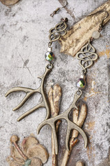 beautiful earrings on vintage background