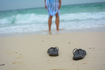 Fototapeta na wymiar Sandals on a beach