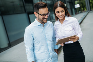 Picture of handsome man and beautiful woman as business partners