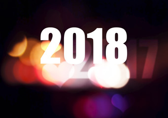 Happy new year 2018 with colorful bokeh background
