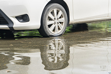 Flooding Car on the Road, selective focus (detailed close-up shot)