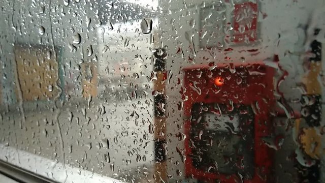 Rain splashes to the window.