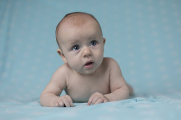 Baby girl lying on belly