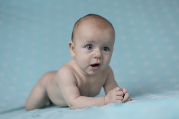 Baby girl lying on belly