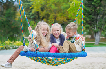 three children playing in the park
