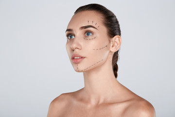 Portrait of attractive woman with plastic surgery at studio