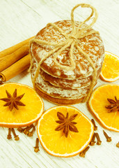Gingerbread cookies, cinnamon and orange slices. Christmas decoration.