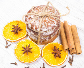 Gingerbread cookies, cinnamon and orange slices. Christmas decoration.