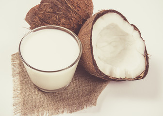 Coconut with coconut milk isolated on white background.