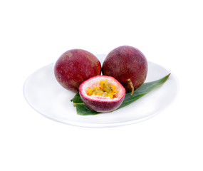 passionfruits in white plate isolated on white background