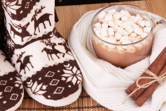 Warm slippers and cocoa with marshmallow.