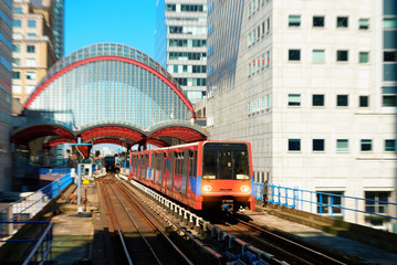 Train leaving station in London Canary Wharf