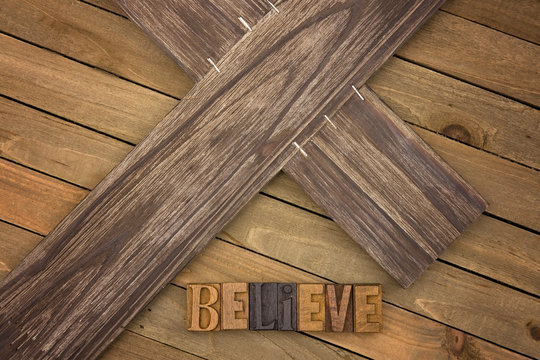 Believe Spelled on a Wooden Table
