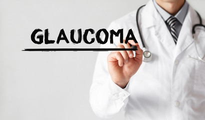Doctor writing word GLAUCOMA with marker, Medical concept