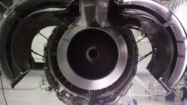 Engine of the airplane under heavy maintenance. Aircraft maintenance, dismantled plane engine. Chassis of the airplane under heavy maintenance