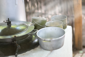 military aluminum cookware under the bright sun
