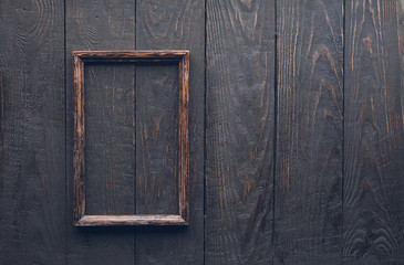 Fototapeta na wymiar photo frame on old wooden wall