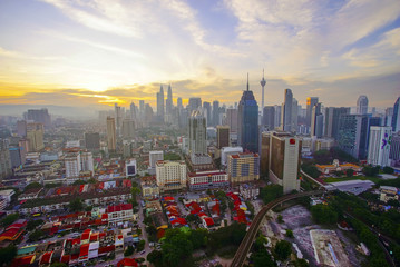 Aerial sunrise view Kuala Lumpur city skyline during beautiful sunrise.