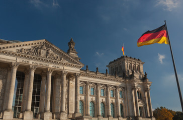 Reichstag building in Berlin with German flag