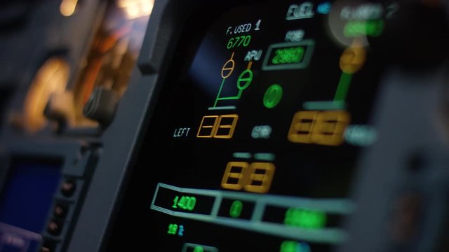 Autopilot control element of an airliner. Panel of switches on an aircraft flight deck. Thrust levers of a twin engined airliner. Pilot controls the aircraft. Onboard computer, cockpit