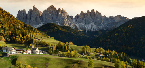 Church of St. Magdalena in front of the Geisler or Odle Dolomites mountain peaks. 
Val di Funes...