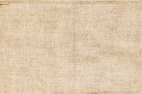 Background and texture of natural brown Sackcloth with Stitches Seam.