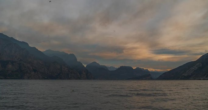 Lake Garda Biggest Lake in Italy Time Lapse of a sunrise with clouds Stock Footage