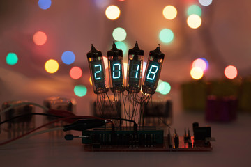 Happy new year is written with a lamp light. Radio electronic lamps. 2018. Original designed...