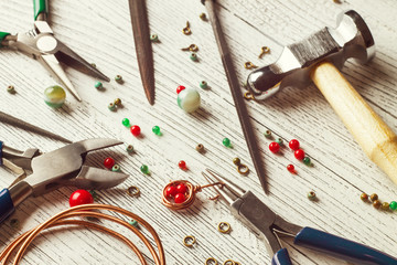 Сolorful beads, copper wire and jewelry tools. Wire wrap