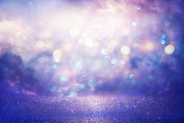 Purple glitter lights background. defocused.