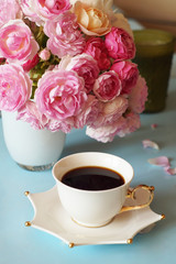 morning coffee on the table and  pink roses, many flowers, beautiful flowers, background