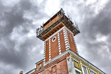 Fototapeta na wymiar Brick communication tower of an abandoned factory 