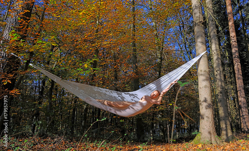 A Beautiful Young Woman Lies Naked In A Self Made Hammock Tied