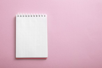 Blank notebook paper on color background
