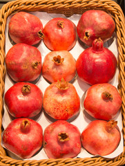 pomegrantes on the basket