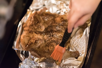 Small cooked chicken smeared brush sauce