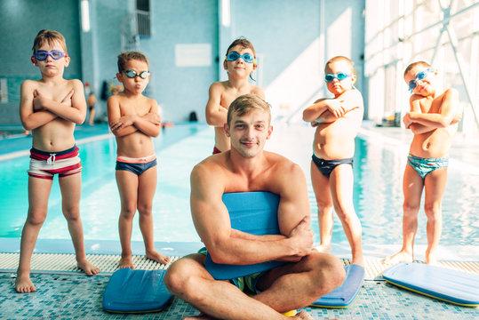 Portrait of male instructor with children