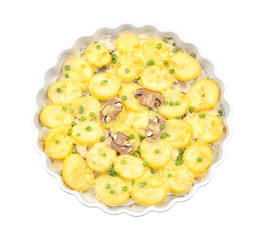 Delicious potato casserole in baking dish, isolated on white