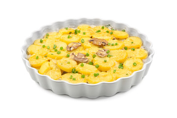 Delicious potato casserole in baking dish, isolated on white