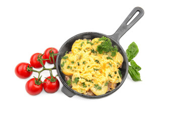 Potato casserole in frying pan and tomatoes, isolated on white