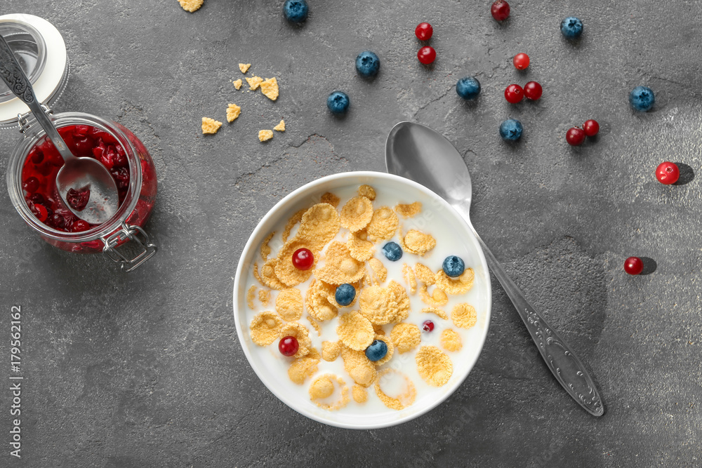 Wall mural dish with cornflakes and milk on table