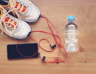 Pair of sport shoes and fitness accessories. Fitness concept