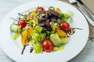 salad with beef liver and citrus fruits