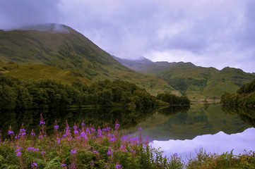 Beautiful and serene landscape of a lake and mountains in the Highlands of Scotland, United Kingdom; Concept for travel in Scotland