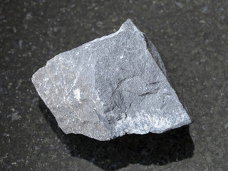 raw argillite stone on dark background