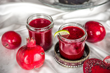 berry jam in a jar and an apple and a grenade from the side