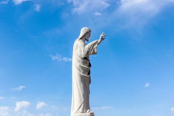 statue of jesus in blue sky at Notre-Dame de la Garde church	