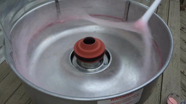 Using cotton candy machine to make treats for party