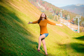 Concept young woman or teenage girl in harmony . Lady in vacation wear in stylish casual look Nice portrait of a carefree friendly sweet redhead girl with a stunning smile and cute face