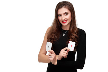 Sexy curly hair brunette posing with two aces cards in her hands, poker concept isolation on white background